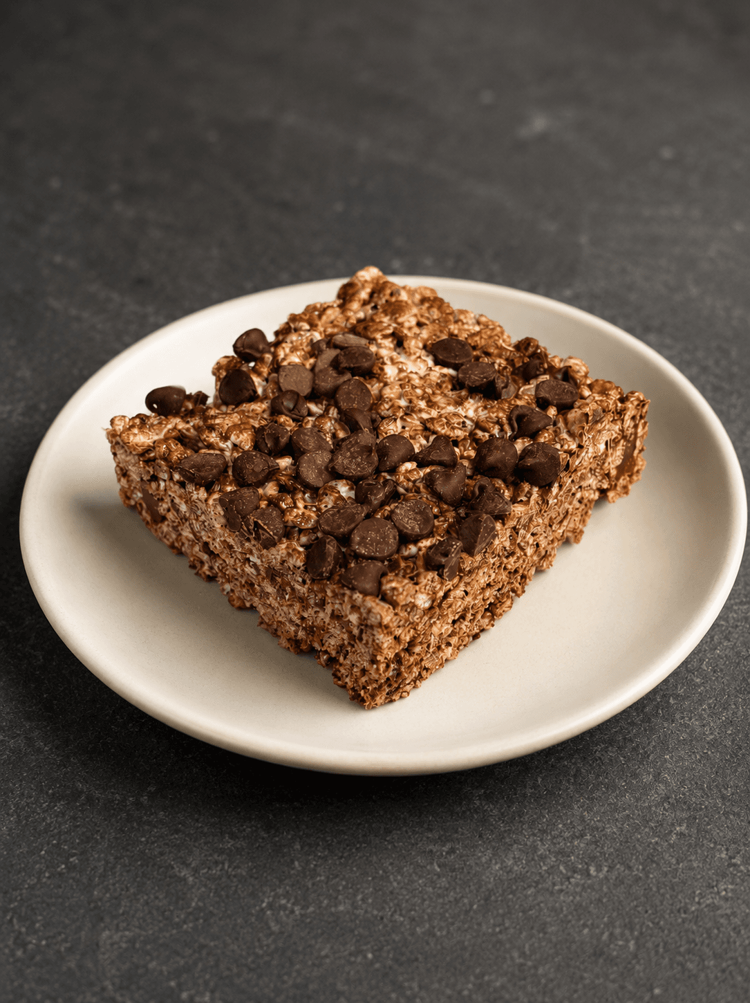 Chocolate crispy treat covered in chocolate chips
